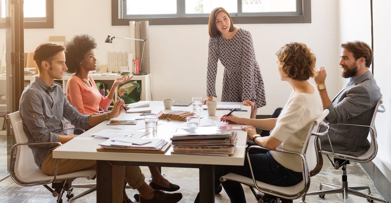 Business people discussing at conference table in board room